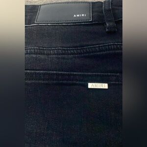 Black and red Amiri jeans